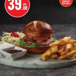 Monoprix gourmet beef burger with fries and coleslaw for QAR 39.00.