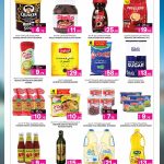 Grocery essentials at Ansar Gallery Qatar showing Quaker oats, Nescafe coffee, Anchor milk powder, and cooking oil.