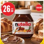 Nutella hazelnut spread with cocoa on offer at Monoprix surrounded by fresh croissants and sliced bread